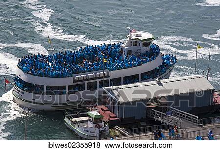 Stock Photo - "The Maid of the Mist carries tourists to the edge of the falls, Niagara Falls, Ontario, Canada, North America". Fotosearch