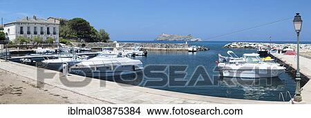 Picture - "The marina of Macinaggio with the barrier island La Giraglia, Corsica, France, Europe". Fotosearch