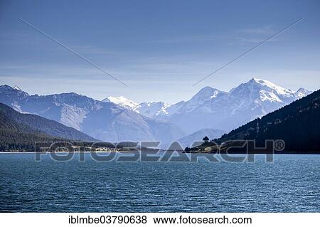 "The massif of Mount Ortler above the Reschensee, from St. Valentin auf der Haide, South Tyrol, Vinschgau, Italy, Europe" View Large Photo Image Stock Photo - "The massif of Mount Ortler above the Reschensee, from St. Valentin auf der Haide, South Tyrol, Vinschgau, Italy, Europe". Fotosearch