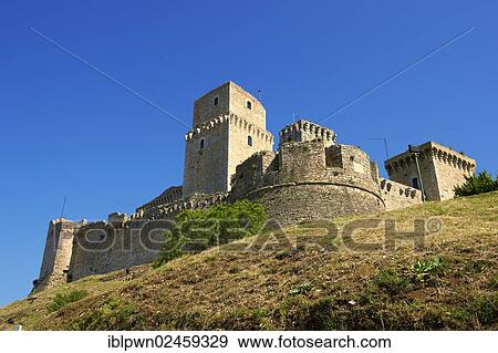 Stock Photo - "The medieval battlements of the Rocca Maggiore castle on the hilltop above Assisi, Italy, Europe". Fotosearch