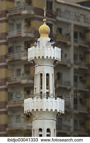 "The minaret of a small mosque in front of an apartment building with balconies, Abu Dhabi, United Arab Emirates, Asia" View Large Photo Image Stock Image - "The minaret of a small mosque in front of an apartment building with balconies, Abu Dhabi, United Arab Emirates, Asia". Fotosearch