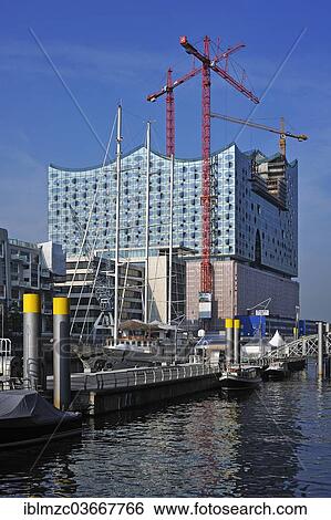 Stock Photograph - "The new Elbe Philharmonic Hall, under construction with cranes, HafenCity, Hamburg, Hamburg, Germany, Europe". Fotosearch