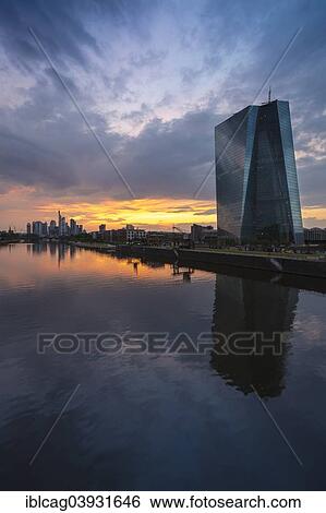 "The new European Central Bank, ECB, in front of the skyline of Frankfurt at sunset, Frankfurt am Main, Hesse, Germany, Europe" View Large Photo Image Stock Photograph - "The new European Central Bank, ECB, in front of the skyline of Frankfurt at sunset, Frankfurt am Main, Hesse, Germany, Europe". Fotosearch