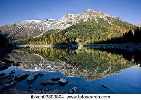 "The Obernberg Tribulaun reflected in Obernberger See, Upper Mountain, Tyrol, Austria, Europe" View Large Photo Image Picture - "The Obernberg Tribulaun reflected in Obernberger See, Upper Mountain, Tyrol, Austria, Europe". Fotosearch