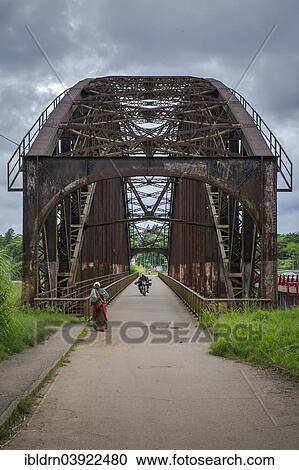 Stock Image - "The old arched bridge, built in 1903, now closed to road traffic, from the German colonial era, made in Oberhausen and assembled on site, Edea, Littoral Region, Cameroon, Africa". Fotosearch