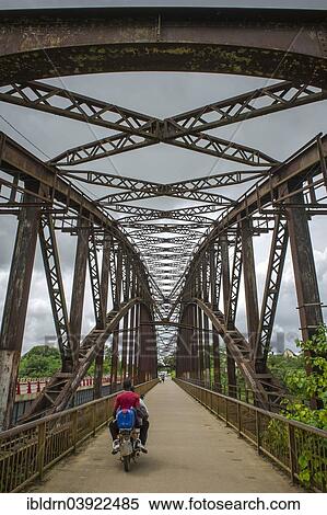 "The old arched bridge, built in 1903, now closed to road traffic, from the German colonial era, made in Oberhausen and assembled on site, Edea, Littoral Region, Cameroon, Africa" View Large Photo Image Stock Photography - "The old arched bridge, built in 1903, now closed to road traffic, from the German colonial era, made in Oberhausen and assembled on site, Edea, Littoral Region, Cameroon, Africa". Fotosearch