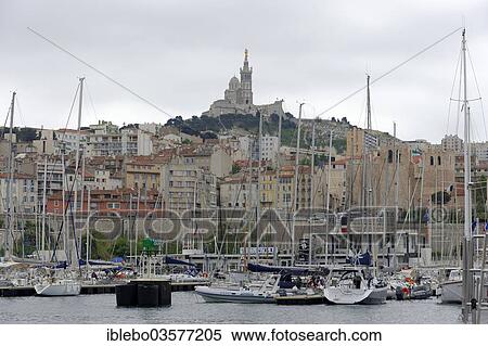 Stock Photography - "The old harbor, Vieux Port, Basilica Notre-Dame de la Garde at back, Marseille, Departement Bouches-du-Rhone, Region Provence-Alpes-Cote dâ€™Azur dâ€™Azur, France, Europe". Fotosearch