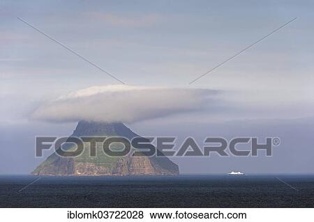 "The only uninhabited island of the Faroe Islands with a ferry of the Smyril Line travelling in the Suouroyarfjorour Strait, Litla Dimun, Faroe Islands, Denmark, Europe" View Large Photo Image Stock Photo - "The only uninhabited island of the Faroe Islands with a ferry of the Smyril Line travelling in the Suouroyarfjorour Strait, Litla Dimun, Faroe Islands, Denmark, Europe". Fotosearch
