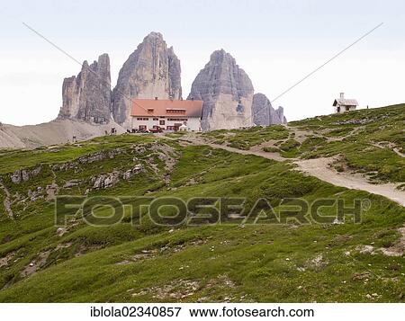 Stock Photo - "The peaks of Tre Cime di Lavaredo with Dreizinnenhuette mountain hut, Dolomiti di Sesto National Park, Sexten Dolomites, Hochpustertal, High Puster Valley, South Tyrol, Italy, Europe". Fotosearch