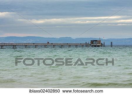 Stock Image - "The pier at sunrise in Altnau on Lake Constance, Canton Thurgau, Switzerland, Europe, PublicGround, Europe". Fotosearch