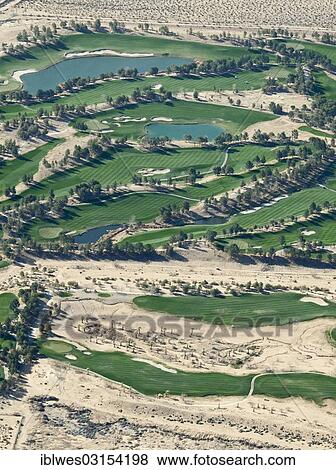 "The Primm Valley Golf Club, scarce desert water is used to water the greens and to keep artificial lakes filled, Mojave Desert, Nipton, California, United States, North America" View Large Photo Image Stock Photo - "The Primm Valley Golf Club, scarce desert water is used to water the greens and to keep artificial lakes filled, Mojave Desert, Nipton, California, United States, North America". Fotosearch
