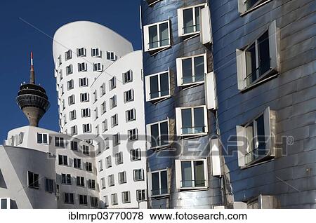 Stock Photo - "The Rheinturm tower and the Gehry buildings or Neuer Zollhof at Medienhafen, Media Harbour, Duesseldorf, North Rhine-Westphalia, Germany, Europe". Fotosearch