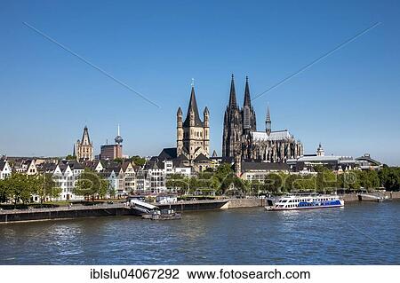 Stock Image - "The Rhine with the historic centre and Cologne Cathedral, Great St. Martin Church and City Hall, Cologne, North Rhine-Westphalia, Germany, Europe". Fotosearch