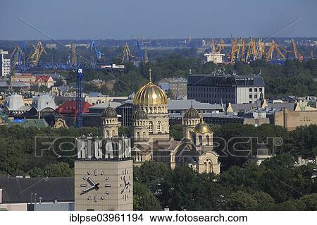 "The Russian Orthodox Nativity of Christ Cathedral, clock tower of the main railway station, dockside cranes, view from high-rise tower of the Academy of Sciences, Riga, Latvia, Europe" View Large Photo Image Picture - "The Russian Orthodox Nativity of Christ Cathedral, clock tower of the main railway station, dockside cranes, view from high-rise tower of the Academy of Sciences, Riga, Latvia, Europe". Fotosearch