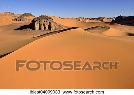 "The sand dunes and rocks of Moul Naga, Tadrart, Unesco World Heritage Site Tassili n' Ajjer National Park, Sahara desert, Algeria, Africa" View Large Photo Image Stock Image - "The sand dunes and rocks of Moul Naga, Tadrart, Unesco World Heritage Site Tassili n' Ajjer National Park, Sahara desert, Algeria, Africa". Fotosearch