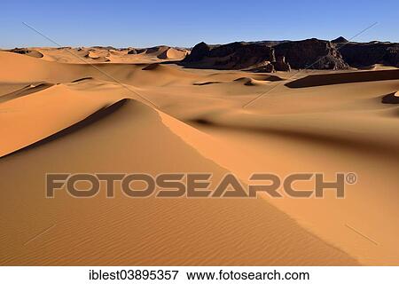 Stock Photo - "The sand dunes and rocks of Moul Naga, Tadrart, Unesco World Heritage Site Tassili n' Ajjer National Park, Sahara desert, Algeria, Africa". Fotosearch