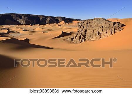"The sand dunes and rocks of Moul Naga, Tadrart region, Unesco World Heritage Site Tassili n' Ajjer National Park, Sahara desert, Algeria, Africa" View Large Photo Image Stock Photography - "The sand dunes and rocks of Moul Naga, Tadrart region, Unesco World Heritage Site Tassili n' Ajjer National Park, Sahara desert, Algeria, Africa". Fotosearch