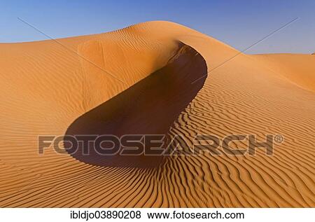 "The sand dunes of the Wahiba Sands desert, also known as Ramlat al-Wahiba or Sharqiya Sands, in evening light, Hawiyah, Ash Sharqiyah, Oman, Asia" View Large Photo Image Stock Photo - "The sand dunes of the Wahiba Sands desert, also known as Ramlat al-Wahiba or Sharqiya Sands, in evening light, Hawiyah, Ash Sharqiyah, Oman, Asia". Fotosearch