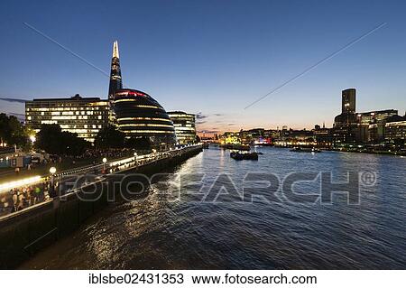 Stock Image - "The Shard Tower, City Hall, River Thames, view from Tower Bridge at dusk, London, England, United Kingdom, Europe". Fotosearch
