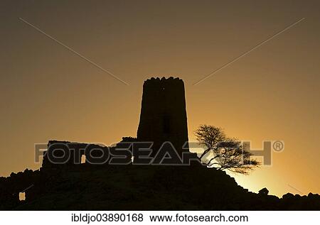 "The silhouette of an old decaying watch tower, Al Mudayrib, Ash Sharqiyah, Oman, Asia" View Large Photo Image Stock Photo - "The silhouette of an old decaying watch tower, Al Mudayrib, Ash Sharqiyah, Oman, Asia". Fotosearch