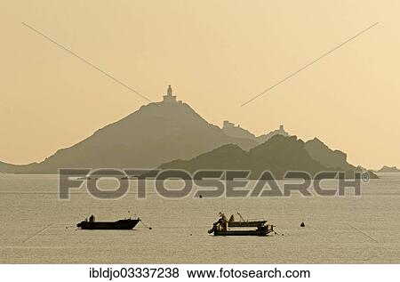 "The silhouette of the islands Les Iles Sanguinaires with small boats in the foreground. Les Iles Sanguinaires are in the department Corse-du-Sud, France on the mediterranean island of Corsica, Pisinale, Ajaccio, Corsica, France, Europe" View Large Photo Image Stock Photo - "The silhouette of the islands Les Iles Sanguinaires with small boats in the foreground. Les Iles Sanguinaires are in the department Corse-du-Sud, France on the mediterranean island of Corsica, Pisinale, Ajaccio, Corsica, France, Europe". Fotosearch