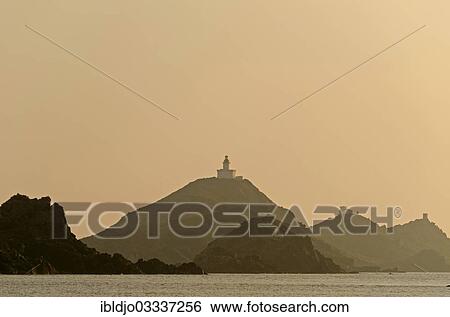 Stock Photograph - "The silhouette of the islands Les Iles Sanguinaires with the lighthouse and a tower. Les Iles Sanguinaires are in the department Corse-du-Sud, France on the mediterranean island of Corsica, Pisinale, Ajaccio, Corsica, France, Europe". Fotosearch