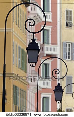 "The silhouettes of street lamps in Ajaccio and the facades of houses in the background. Ajaccio is the capital of the mediterranean island of Corsica, France. It is in the department of Corse-du-Sud, Ajaccio, Corsica, France, Europe" View Large Photo Image Stock Image - "The silhouettes of street lamps in Ajaccio and the facades of houses in the background. Ajaccio is the capital of the mediterranean island of Corsica, France. It is in the department of Corse-du-Sud, Ajaccio, Corsica, France, Europe". Fotosearch