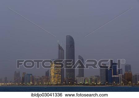 Stock Photograph - "The skyline of Abu-Dhabi at dusk, Abu Dhabi, United Arab Emirates, Asia". Fotosearch