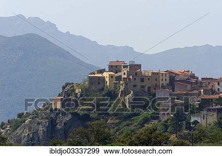 "The small village of Montegrosso in front of the steep mountains of Corsica, Montegrosso, Corsica, France, Europe" View Large Photo Image Stock Photo - "The small village of Montegrosso in front of the steep mountains of Corsica, Montegrosso, Corsica, France, Europe". Fotosearch