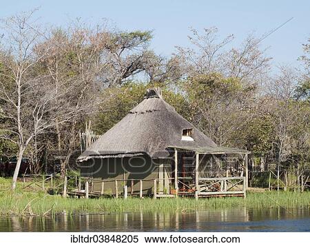 "The so-called Island Tents accomodation at the Camp Kwando, built on poles right at the river bank of the Kwando River, Caprivi region, Namibia, Africa" View Large Photo Image Stock Photography - "The so-called Island Tents accomodation at the Camp Kwando, built on poles right at the river bank of the Kwando River, Caprivi region, Namibia, Africa". Fotosearch