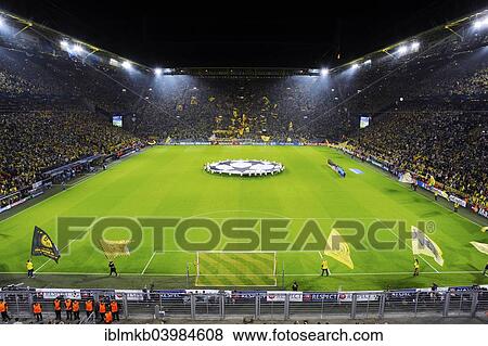 "The sold-out Signal Iduna Arena before the kickoff of the UEFA Champions League game Borussia Dortmund vs Arsenal, Dortmund, North Rhine-Westphalia, Germany, Europe" View Large Photo Image Stock Photo - "The sold-out Signal Iduna Arena before the kickoff of the UEFA Champions League game Borussia Dortmund vs Arsenal, Dortmund, North Rhine-Westphalia, Germany, Europe". Fotosearch