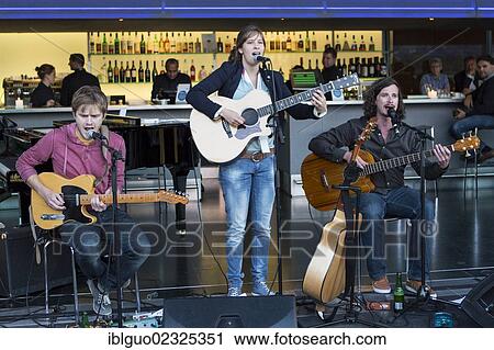 "The Swiss composer and guitarist Martina Linn playing live in front of the KKL bar by the lake at the Blue Balls Festival, Lucerne, Switzerland, Europe" View Large Photo Image Stock Image - "The Swiss composer and guitarist Martina Linn playing live in front of the KKL bar by the lake at the Blue Balls Festival, Lucerne, Switzerland, Europe". Fotosearch