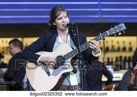 "The Swiss composer and guitarist Martina Linn playing live in front of the KKL bar by the lake at the Blue Balls Festival, Lucerne, Switzerland, Europe" View Large Photo Image Stock Image - "The Swiss composer and guitarist Martina Linn playing live in front of the KKL bar by the lake at the Blue Balls Festival, Lucerne, Switzerland, Europe". Fotosearch