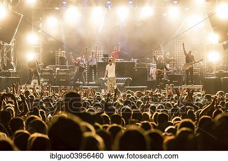 Stock Image - "The Swiss rapper and musician Marco Bliggensdorfer, also know as Bligg, performing live at Heitere Open Air, Zofingen, Canton of Aargau, Switzerland, Europe". Fotosearch