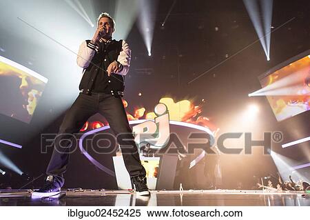 Stock Photography - "The Swiss singer and guitarist Manu-L and the Swiss house-DJ and producer Remady performing live at Energy Stars For Free event, Hallenstadion Zuerich hall, Zurich Switzerland, Europe". Fotosearch