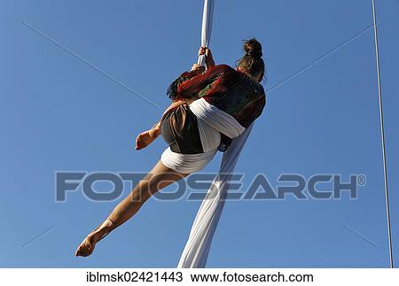 Stock Image - The third Brueckensensationen street theatre festival, Andrea Beck performing as Madame Nathalie on the trapeze, Rheinfelden - Baden, Baden-Wuerttemberg, Germany, Europe. Fotosearch