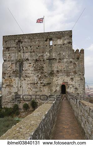 Stock Image - "The Tower of Homage of The Moorish Castle with flying Union Flag, Upper Rock Nature Reserve, Rock of Gibraltar, British overseas territory of Gibraltar". Fotosearch
