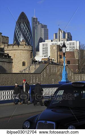 Picture - "The Tower of London in front of Abbey Business Centre, The Gherkin, viewed from Tower Bridge, City of London, London, London region, England, United Kingdom, Europe". Fotosearch