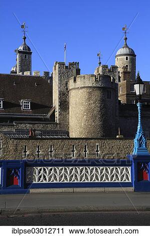 Stock Image - "The Tower of London, seen from the approach of the Tower Bridge, City of London, London, London region, England, United Kingdom, Europe". Fotosearch
