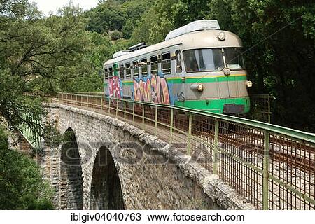 "The Trenino Verde narrow-gauge railway en route from Arbatax to Mandas on a bridge near Niala, Ussassai, Province of Ogliastra, Sardinia, Italy, Europe" View Large Photo Image Stock Image - "The Trenino Verde narrow-gauge railway en route from Arbatax to Mandas on a bridge near Niala, Ussassai, Province of Ogliastra, Sardinia, Italy, Europe". Fotosearch