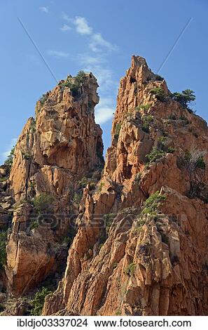 "The typical bizarre red rocks of the Calanche of Piana below a blue sky and some clouds. The Calanche of Piana is in the western part of the island Corsica, France, Calanques de Piana, Piana, Corsica, France, Europe" View Large Photo Image Picture - "The typical bizarre red rocks of the Calanche of Piana below a blue sky and some clouds. The Calanche of Piana is in the western part of the island Corsica, France, Calanques de Piana, Piana, Corsica, France, Europe". Fotosearch