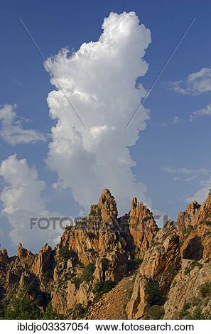 "The typical bizarre red rocks of the Calanche of Piana below a blue sky and some clouds. The Calanche of Piana is in the western part of the island Corsica, France, Calanques de Piana, Piana, Corsica, France, Europe" View Large Photo Image Picture - "The typical bizarre red rocks of the Calanche of Piana below a blue sky and some clouds. The Calanche of Piana is in the western part of the island Corsica, France, Calanques de Piana, Piana, Corsica, France, Europe". Fotosearch