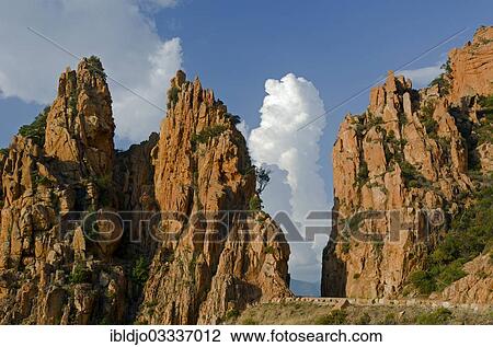 "The typical bizarre red rocks of the Calanche of Piana below a blue sky and some clouds. The Calanche of Piana is in the western part of the island Corsica, France, Calanques de Piana, Piana, Corsica, France, Europe" View Large Photo Image Stock Image - "The typical bizarre red rocks of the Calanche of Piana below a blue sky and some clouds. The Calanche of Piana is in the western part of the island Corsica, France, Calanques de Piana, Piana, Corsica, France, Europe". Fotosearch