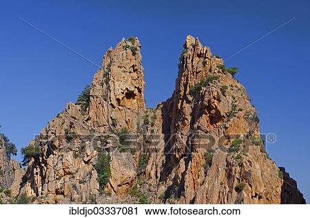 "The typical bizarre red rocks of the Calanche of Piana below a blue sky. The Calanche of Piana is in the western part of the island Corsica, Corse-du-Sud, France, Calanques de Piana, Piana, Corsica, France, Europe" View Large Photo Image Stock Image - "The typical bizarre red rocks of the Calanche of Piana below a blue sky. The Calanche of Piana is in the western part of the island Corsica, Corse-du-Sud, France, Calanques de Piana, Piana, Corsica, France, Europe". Fotosearch