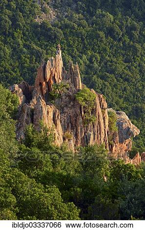 "The typical bizarre red rocks of the Calanche of Pianasurrounded by green scrub. The Calanche of Piana is in the western part of the island Corsica, France, Calanques de Piana, Piana, Corsica, France, Europe" View Large Photo Image Stock Photograph - "The typical bizarre red rocks of the Calanche of Pianasurrounded by green scrub. The Calanche of Piana is in the western part of the island Corsica, France, Calanques de Piana, Piana, Corsica, France, Europe". Fotosearch