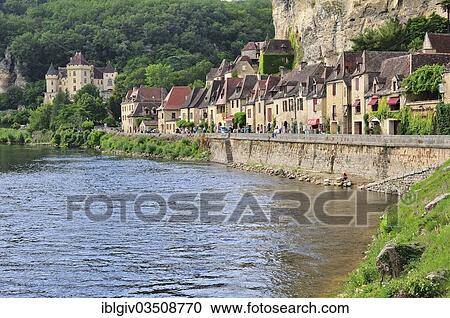 Stock Image - "The village houses hugging the cliff in La Roque-Gageac, La Roque-Gageac, Dordogne, Aquitanien, France, Europe". Fotosearch