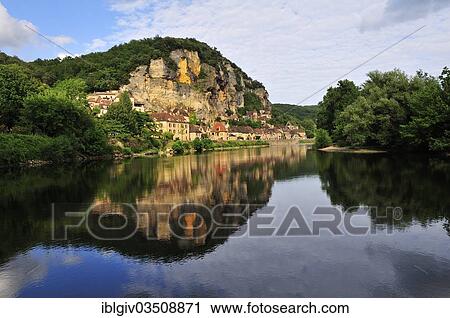 Stock Image - "The village of La Roque-Gageac reflected in the water of the Dordogne river, La Roque-Gageac, Dordogne, Aquitanien, France, Europe". Fotosearch
