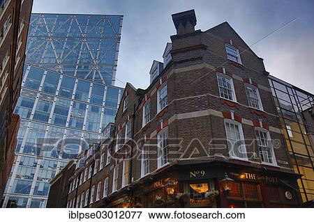 "The Water Poet pub in Folgate Street in front of a modern office building, Spitalfields, London, London region, England, United Kingdom, Europe" View Large Photo Image Stock Photo - "The Water Poet pub in Folgate Street in front of a modern office building, Spitalfields, London, London region, England, United Kingdom, Europe". Fotosearch
