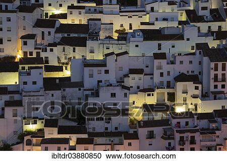 Stock Image - "The White Town of Casares clings to a steep hillside, at dawn, Malaga province, Andalusia, Spain, Europe". Fotosearch