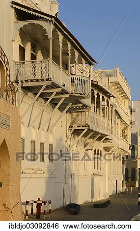Stock Photograph - "The white wooden merchant houses with their typical balconies, Muttrah, Muscat Governorate (Capital Area, Oman, Asia". Fotosearch